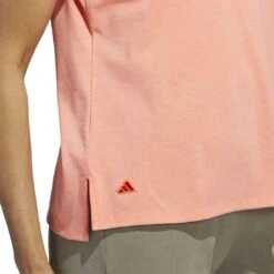 Adidas 2023 Women's Go-To Heathered Polo -EliteGolf Store adidas 23 womens go to heathered polo coral fusion detail2 itempicture